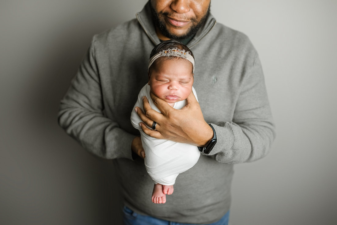 portrait of new parents with newborn baby in Memphis, TN