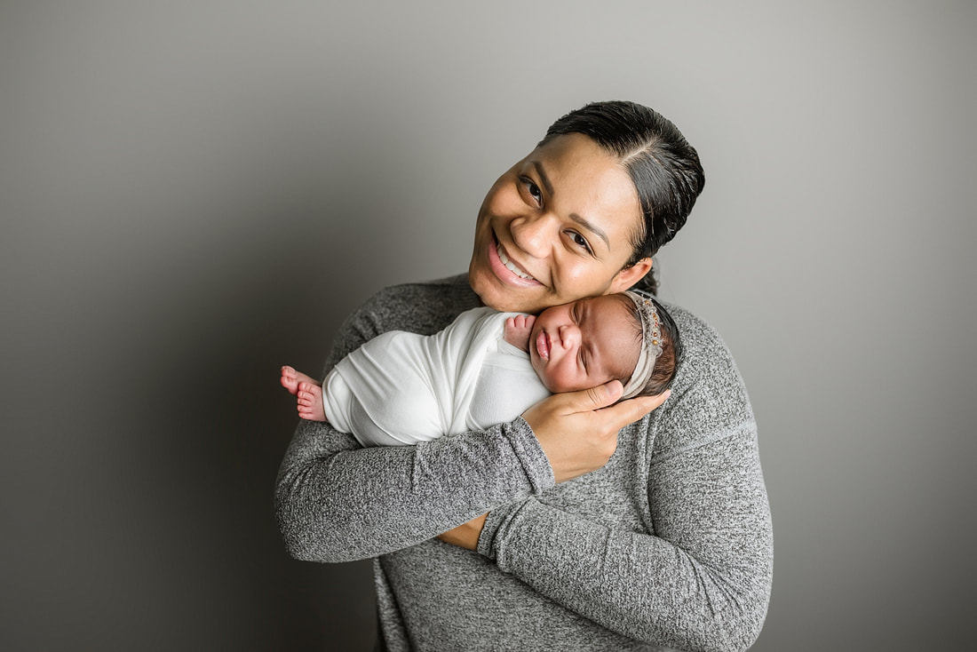 portrait of new parents with newborn baby in Memphis, TN