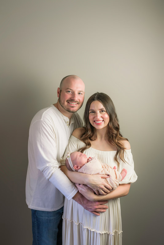portrait of new parents with newborn baby in Memphis, TN