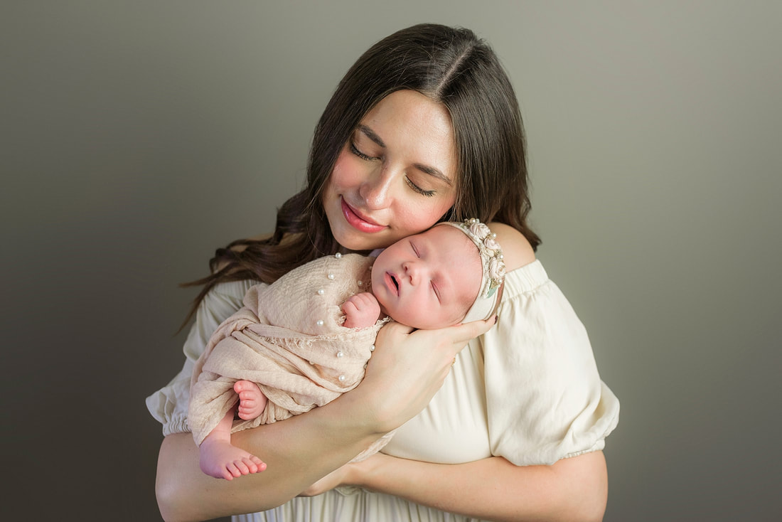 portrait of new parents with newborn baby in Memphis, TN