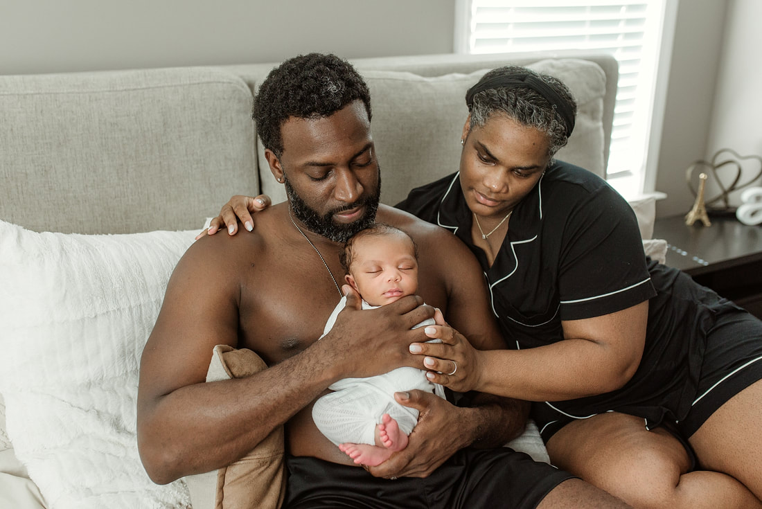 portrait of new parents with newborn baby in Memphis, TN