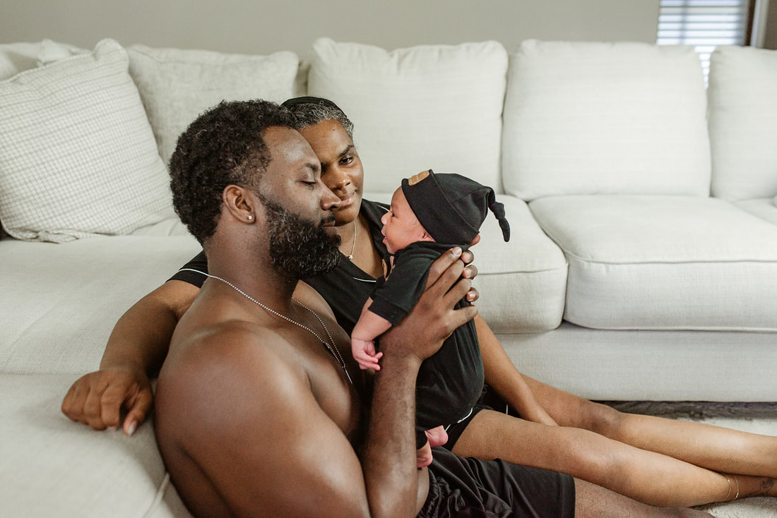portrait of new parents with newborn baby in Memphis, TN